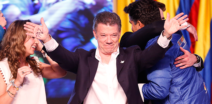Juan Manuel Santos shows his pleasure and his campaign plank for peace as he accepts victory in Colombia