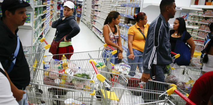 Venezuelans are stripped of their individuality as the "masses" form endless lines at the supermarket. 